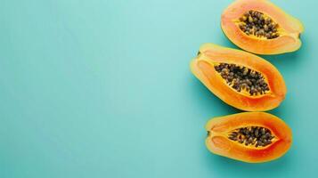 Papaya fruits top view on the pastel background photo