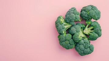 Broccoli vegetables healthy food top view on the pastel background photo