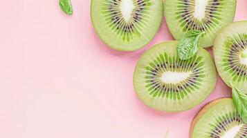 Kiwi fruits top view on the pastel background photo