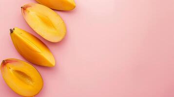 Mango fruits top view on the pastel background photo