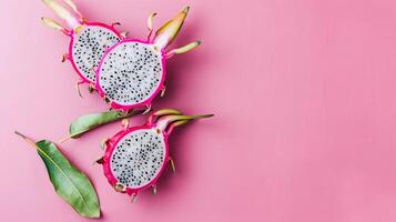 Dragon fruits healthy food top view on the pastel background photo