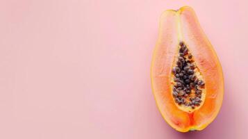 Papaya fruits top view on the pastel background photo