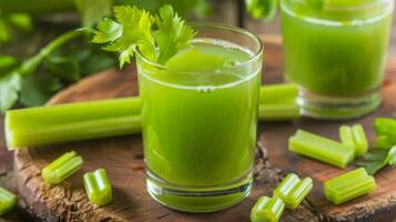 Glass of Celery Juice on Wooden Table photo