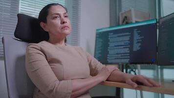 Freelance coding, discouraged, tired of computer technology work, she is thinking too much, brain lagging behind the computer screen video