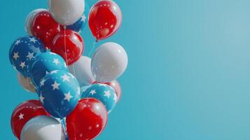 Patriotic balloons in red, white and blue colors against blue sky. Celebration of American national holidays concept. photo