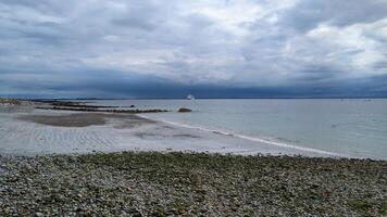 Huge cruiser ship anchored near Salthill beach at Galway bay, Ireland, ocean and transportation background photo