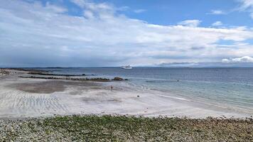 Huge cruiser ship anchored near Salthill beach at Galway bay, Ireland, ocean and transportation background photo