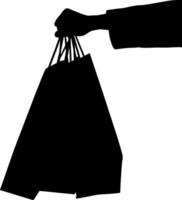 Silhouette of a woman with a shopping bag. vector