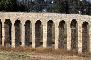 An ancient aqueduct for supplying water to populated areas. photo