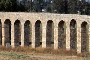 An ancient aqueduct for supplying water to populated areas. photo