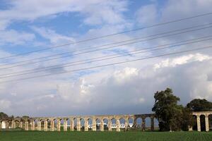 An ancient aqueduct for supplying water to populated areas. photo