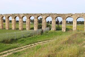 An ancient aqueduct for supplying water to populated areas. photo