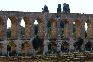 An ancient aqueduct for supplying water to populated areas. photo