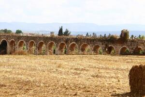 An ancient aqueduct for supplying water to populated areas. photo