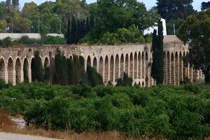 An ancient aqueduct for supplying water to populated areas. photo