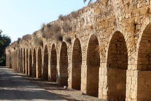 An ancient aqueduct for supplying water to populated areas. photo