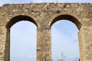 An ancient aqueduct for supplying water to populated areas. photo