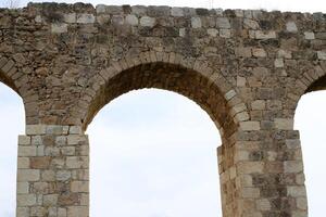 An ancient aqueduct for supplying water to populated areas. photo