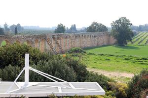 An ancient aqueduct for supplying water to populated areas. photo