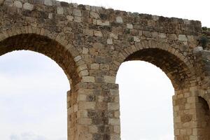 An ancient aqueduct for supplying water to populated areas. photo