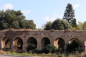 An ancient aqueduct for supplying water to populated areas. photo