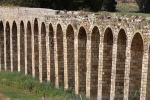 An ancient aqueduct for supplying water to populated areas. photo