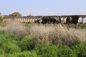 An ancient aqueduct for supplying water to populated areas. photo