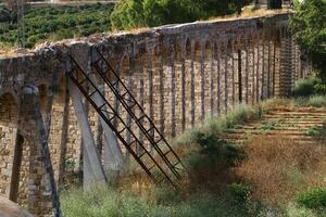 An ancient aqueduct for supplying water to populated areas. photo