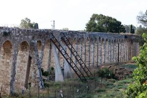 An ancient aqueduct for supplying water to populated areas. photo