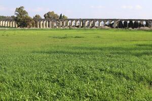 An ancient aqueduct for supplying water to populated areas. photo