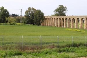 An ancient aqueduct for supplying water to populated areas. photo