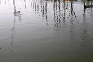 The color of water in the Mediterranean Sea in shallow water. Natural abstract background. photo