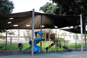 Items for games and sports on the playground in the city park. photo