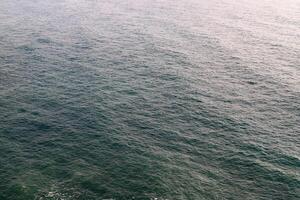 The color of water in the Mediterranean Sea in shallow water. Natural abstract background. photo