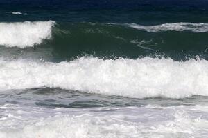 The color of water in the Mediterranean Sea in shallow water. Natural abstract background. photo