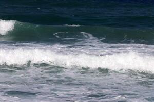 The color of water in the Mediterranean Sea in shallow water. Natural abstract background. photo