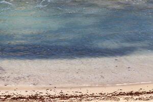 The color of water in the Mediterranean Sea in shallow water. Natural abstract background. photo