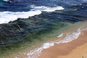 The color of water in the Mediterranean Sea in shallow water. Natural abstract background. photo