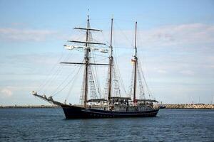 Masts in the port against the blue sky. photo