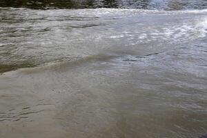 The color of water in the Mediterranean Sea in shallow water. Natural abstract background. photo