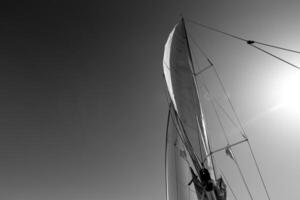 Masts in the port against the blue sky. photo