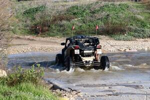 The car was carried away by a strong rain flow of water. photo