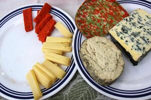 Table in a restaurant with a variety of snacks and food. photo