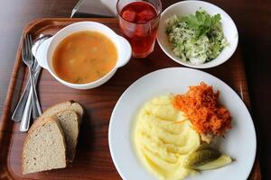 Table in a restaurant with a variety of snacks and food. photo