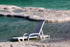 The Dead Sea is a closed, endorheic body of water in the Middle East between Israel and Jordan. photo