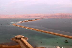 The Dead Sea is a closed, endorheic body of water in the Middle East between Israel and Jordan. photo