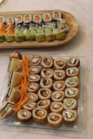 On the table in a sushi restaurant is a dish of traditional Japanese cuisine. photo