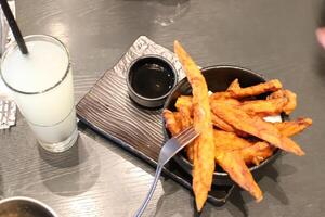 On the table in a sushi restaurant is a dish of traditional Japanese cuisine. photo