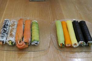 On the table in a sushi restaurant is a dish of traditional Japanese cuisine. photo