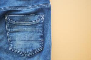man jeans on a bright yellow background with copy space. photo